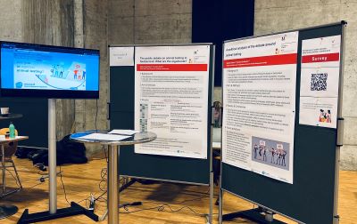 The EPL booth featuring a questionaire on visitors opinions on animal testing, and posters on the public debate on animal testing in Switzerland.